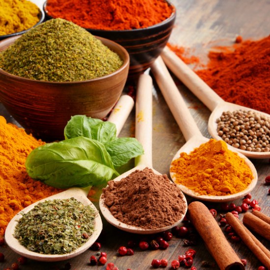 Variety of spices on kitchen table.